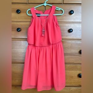 In girl / Dillards dress- size 6x. Bright coral and flows.